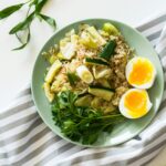 Nutritious bowl with rice, boiled egg, and coriander leaves - a heart-healthy meal to lower cholesterol through diet